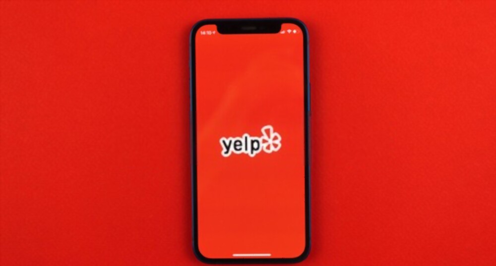 MMR cited favorably as client wins long-running lawsuit YELP lawsuit image on phone